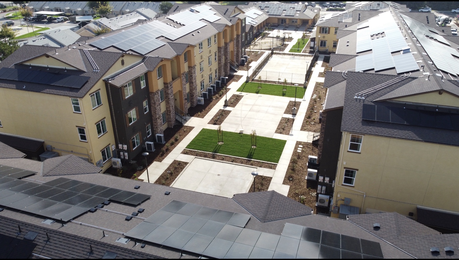 Tierrasanta Villas courtyard and rooftop solar panels